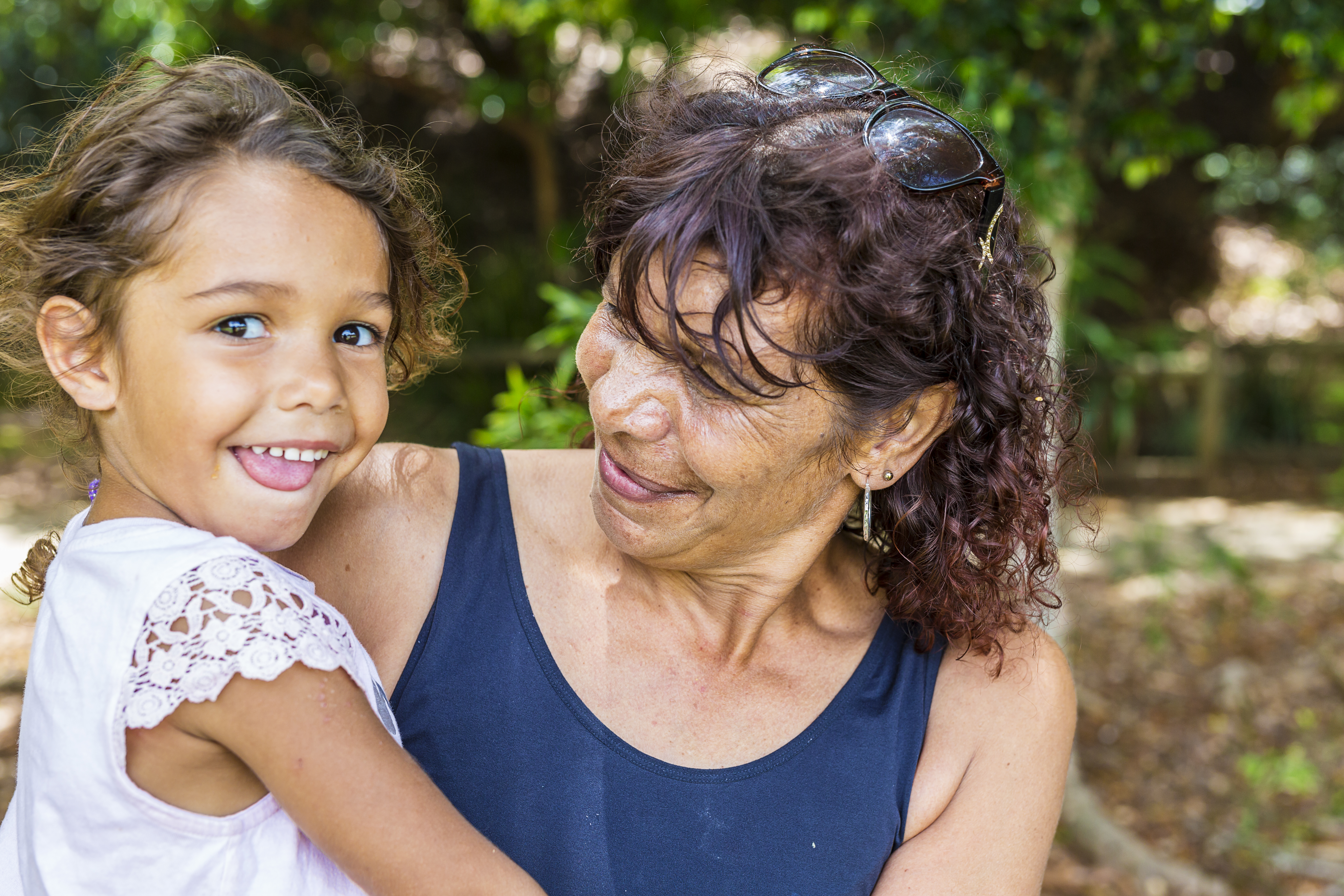 Australian Aboriginal Woman Hugging Her Granddaughter