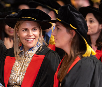 New Fellows holding their bonnets after the College ceremony.