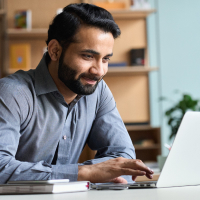 Gentleman browsing on his laptop